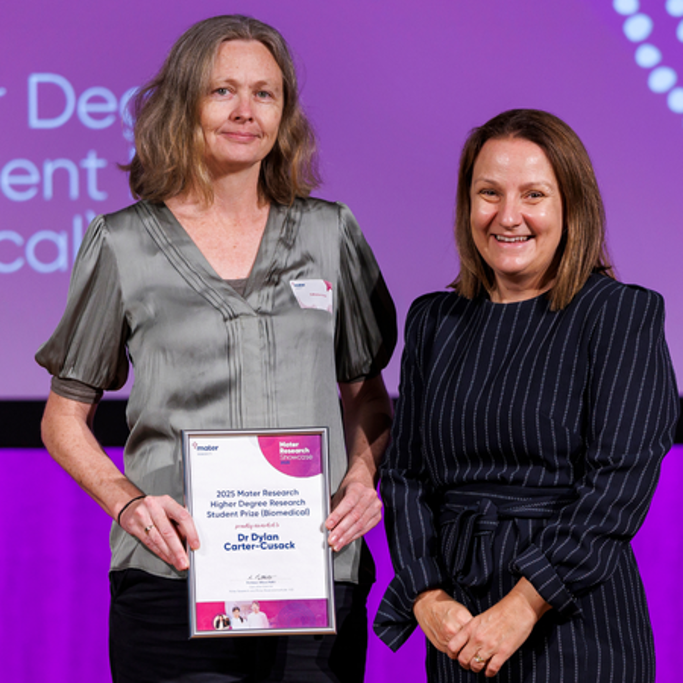 Associate Professor Kate Irvine, accepting the prize on Dr Carter-Cusack's behalf, and Professor Kerrie Wilson