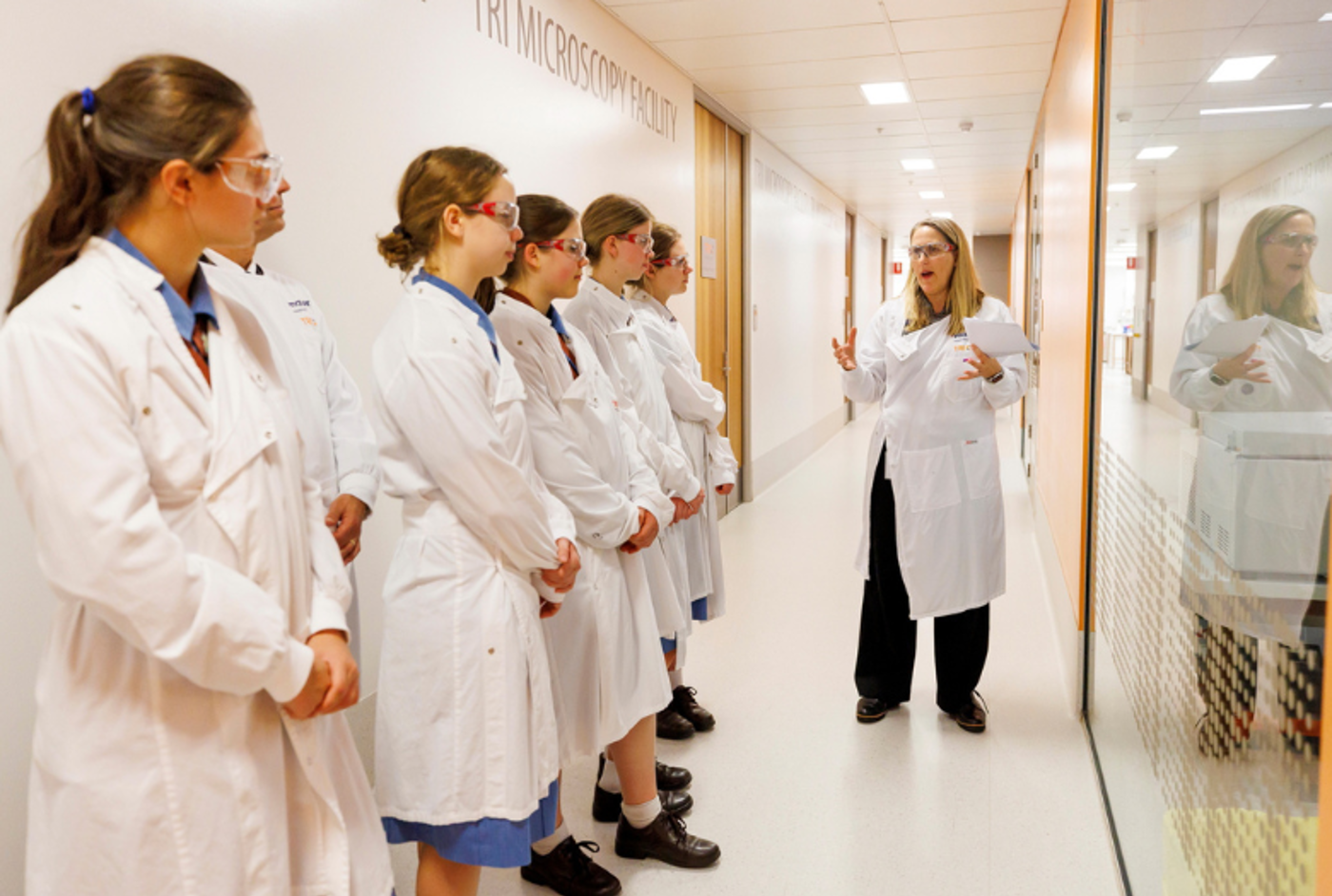 Professor Allison Pettit and students from All Hallows' School touring the TRI lab